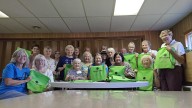 Altrusa of Bedford assembles 255 book bags for local preschoolers