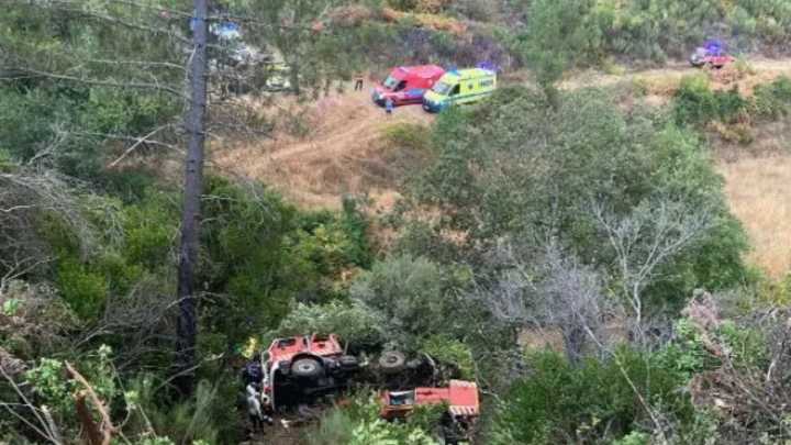 Two firefighters dead & three fighting for life after truck skids off road & plunges into ravine while on emergency call