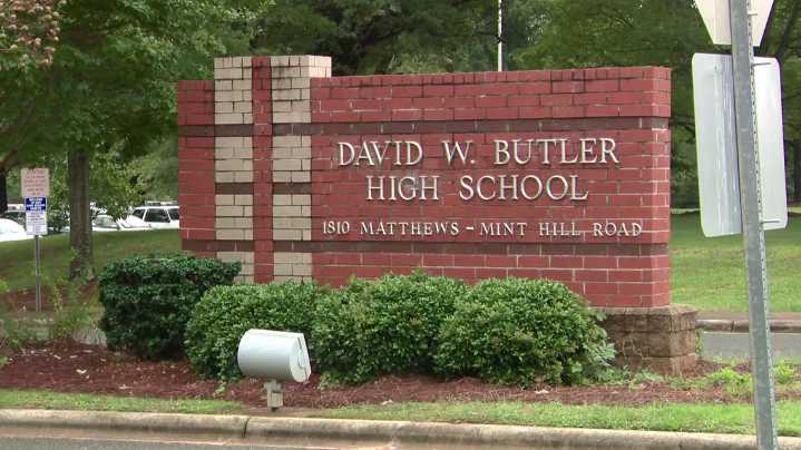 Butler High School employee charged with bringing guns to school: Police