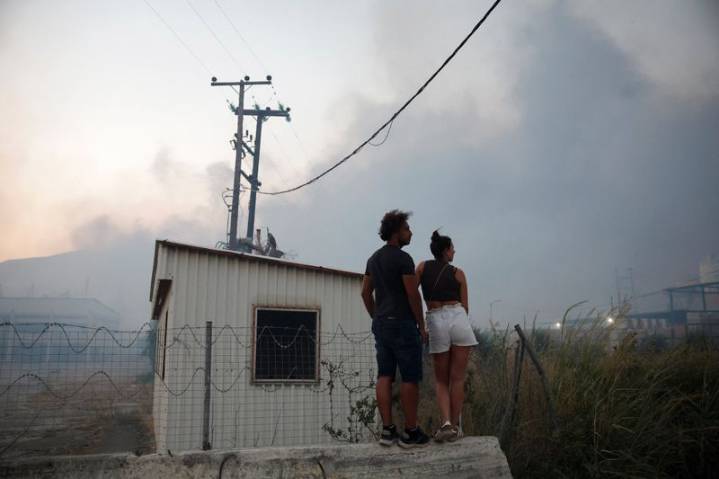 Wildfires scorch Greece for a second day, thousands evacuated
