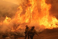 A wildfire continues to burn through the mountains north of LA, with thousands under evacuation orders