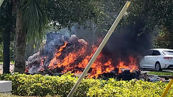 WM driver forced to dump trash that had burst into flames
