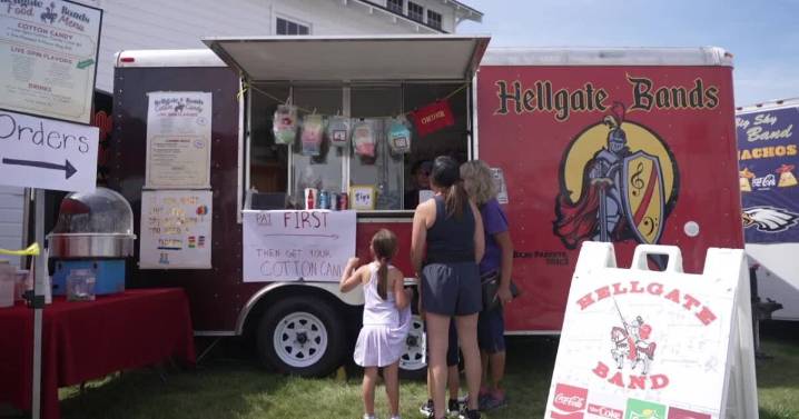 Students serve up cotton candy to support band program at Western Montana Fair