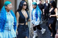 North West matches her blue hair to her denim set in Rome with Kim Kardashian