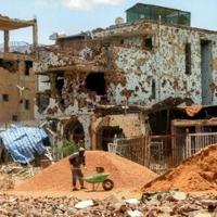 Sudanese lay first bricks to rebuild war