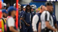 CeeDee Lamb takes big hit from sprinting official while WR is in street clothes on the sideline