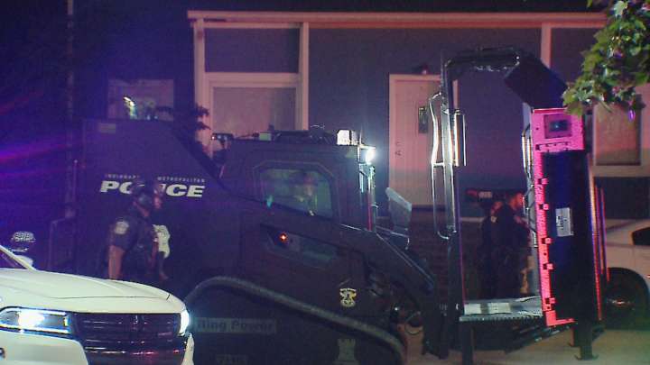 SWAT team ends hours-long standoff after suspect shoots woman