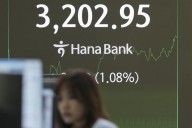 Asian shares track Wall Street's rally after Powell hints at rate cuts