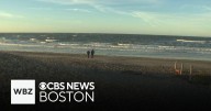 Onlookers head to the beach in Scituate to see the waves from Hurricane Erin