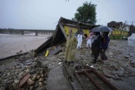 Flash floods leave 34 dead in Indian-controlled Kashmir as over 200,000 in Pakistan are displaced