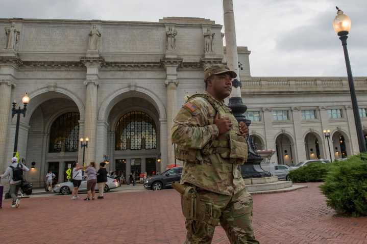 Some National Guard units in Washington are now carrying firearms in escalation of Trump deployment