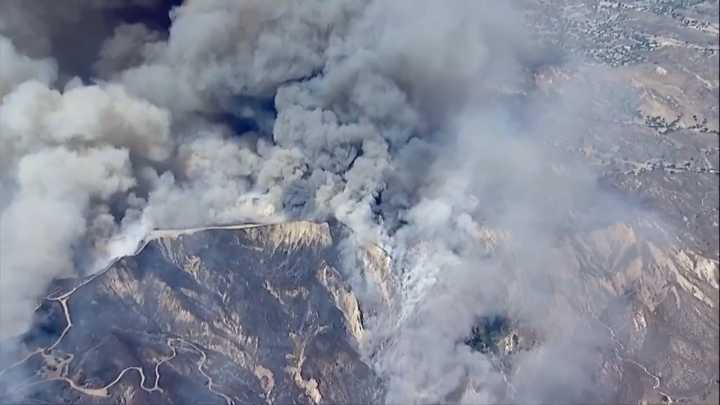 Fast-growing brush fire forces thousands to evacuate north of Los Angeles