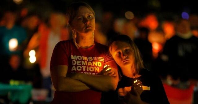 Hundreds honor 2 children killed and 17 people wounded in shooting at a Minneapolis Catholic school