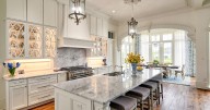 We've learned a lot about interior design from the movies. The white kitchen is the scene stealer.