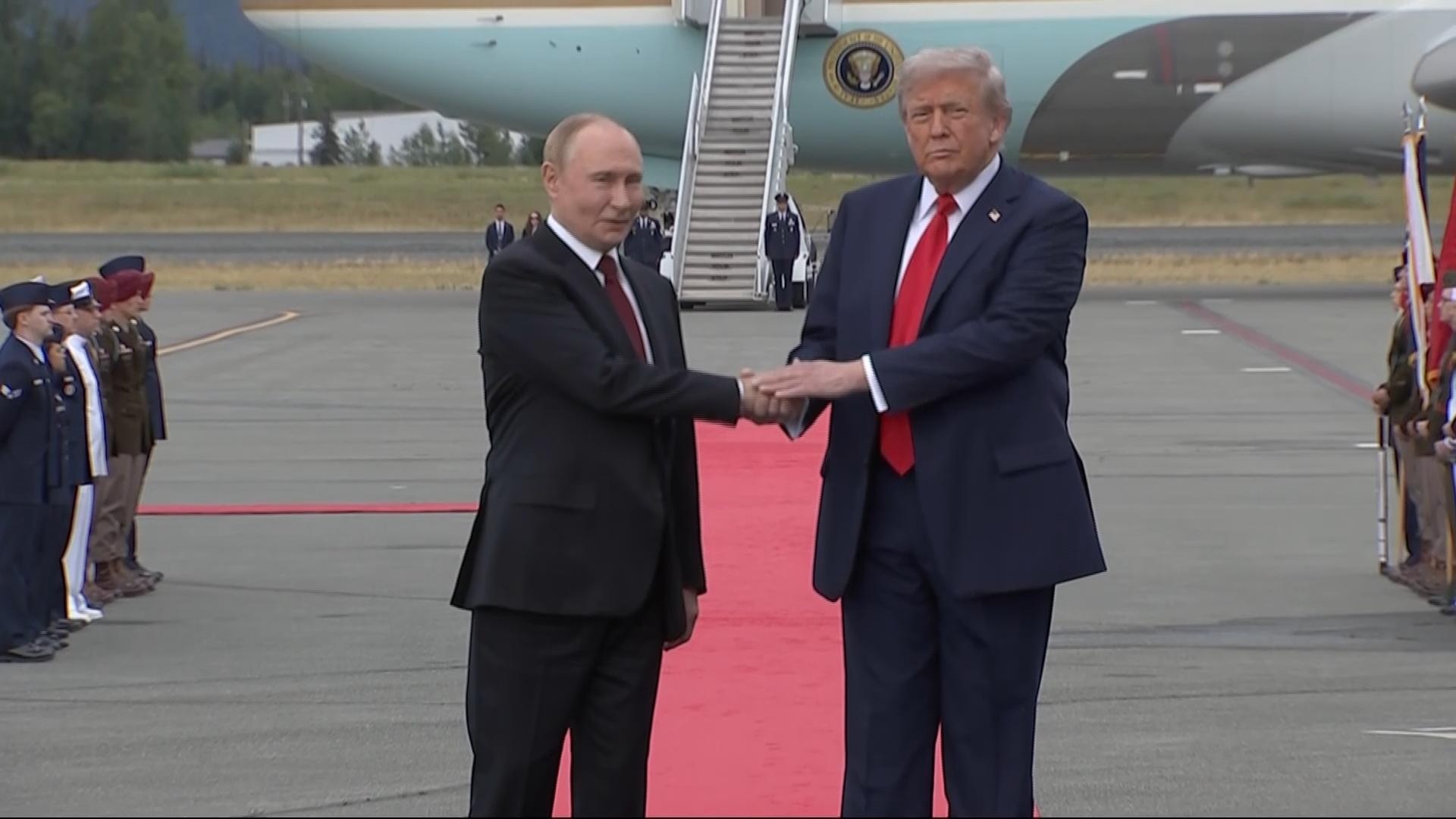 Trump arrives at Alaska military base, greets Putin on tarmac before summit on Russia