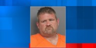 Man with 20 outstanding warrants found hiding under insulation in Moline attic