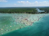 Man dies after suffering medical emergency while riding jet ski on Torch Lake