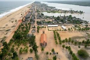 Ivory Coast village reburies relatives as rising sea engulfs cemetery