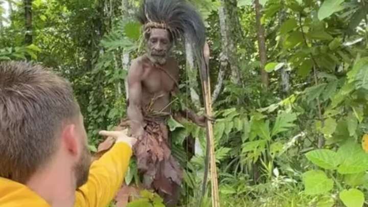 Shocking moment idiot YouTuber risks being speared by untouched ‘cannibal’ tribe as his bizarre peace offering backfires