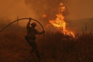 Firefighters make progress against blaze that forced thousands to flee north of Los Angeles