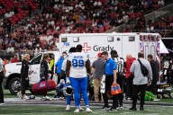 NFL game ends with prayers on the field as player taken off in ambulance