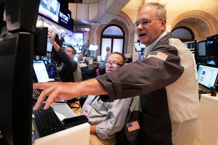 Wall Street rallies and the Dow soars 900 points on hopes for lower interest rates