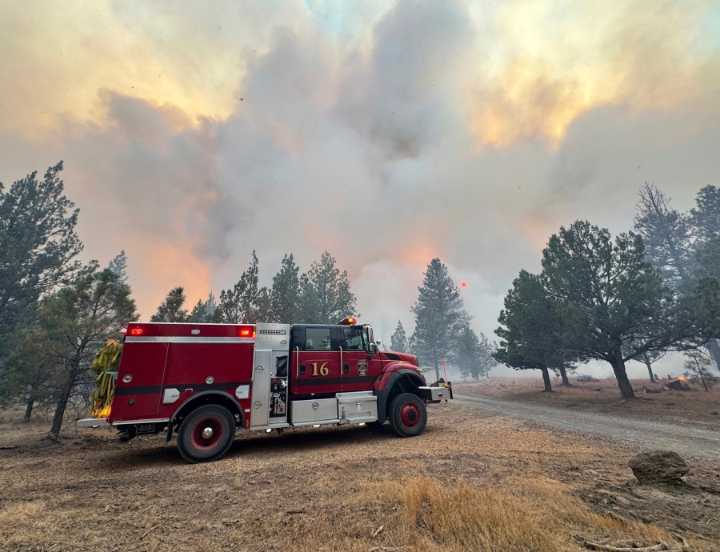 Firefighters try to corral California forest blaze as lightning strikes bring risk of new ignitions