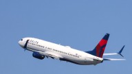 Delta flight attendant accused of slapping passenger on cross