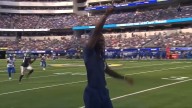 CeeDee Lamb takes big hit from sprinting official while WR is in street clothes on the sideline