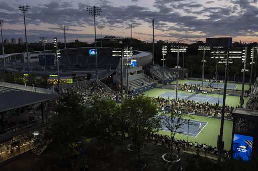 At the US Open, tennis stars shine under dark sky