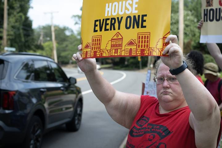 Protesters deliver letter to Hill’s door opposing cuts to federal programs