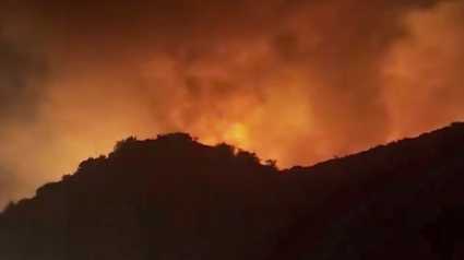 King Fire: Firefighters battle wildfire burning along I