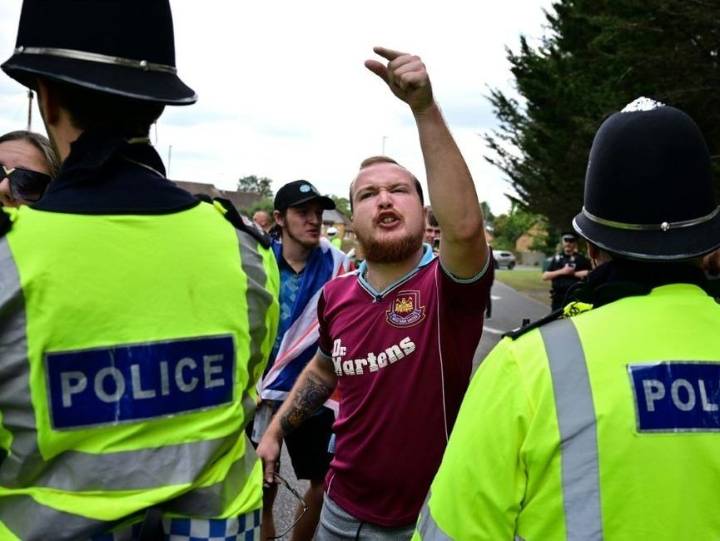 U.K. vows to speed up asylum claims as hotel protests spread