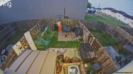 VIDEO: Escaped inmate climbs into backyard, hides from police in trash can