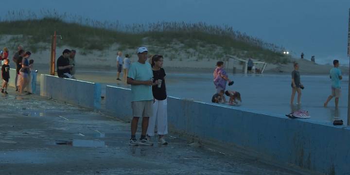 Locals and tourists enjoy winds and waves at Atlantic Beach from Hurricane Erin