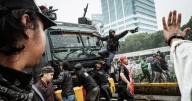Riot police clash with students protesting lawmakers’ perks in Indonesia
