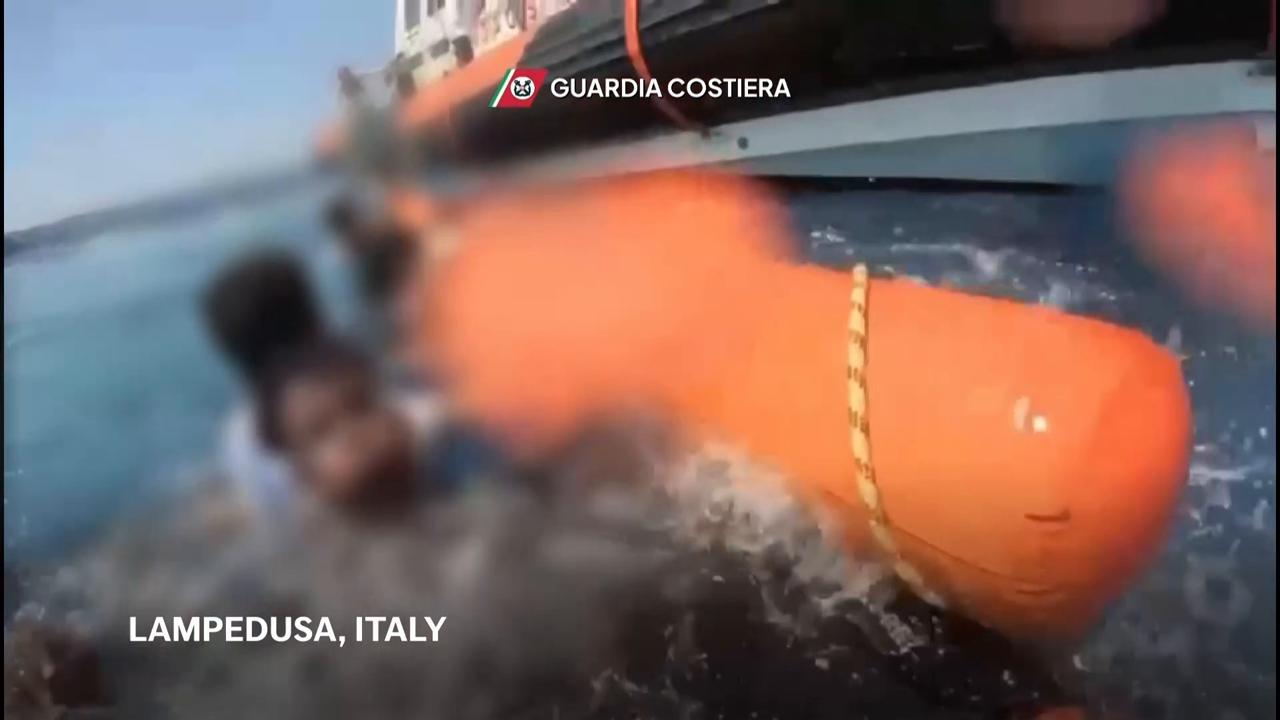 Coast Guard struggles to save migrants whose boat overturned off Italy, killing 26