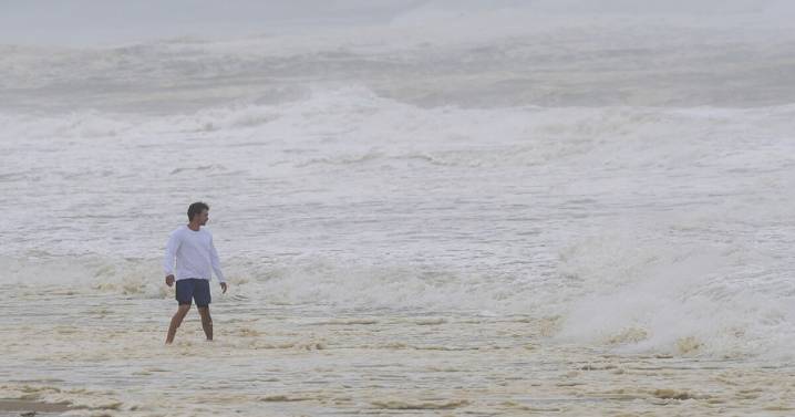 Hurricane Erin stirs up strong winds and large waves as it moves away from the US