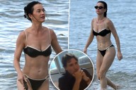 Katy Perry flaunts her chiseled abs in a black bikini