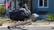 Car crashes into power line, causing road closure on South Side