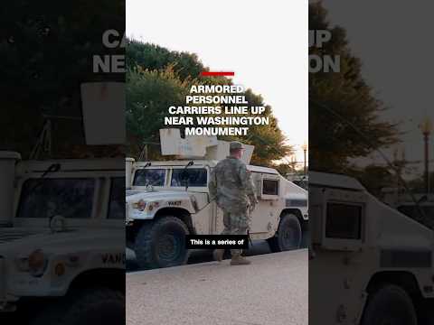 Armored personnel carriers line up near Washington Monument