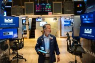 Wall Street holds steadier following mixed profit reports from Target, Lowe’s and other retailers