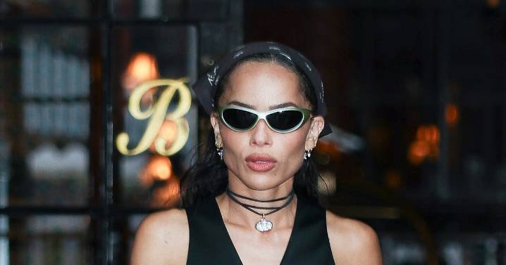 Zoë Kravitz Flashes Her Abs in Plunging Waistcoat & Slouchy Office Pants