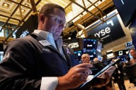 Most US stocks fall after a disappointing inflation update, but Big Tech keeps Wall Street steady