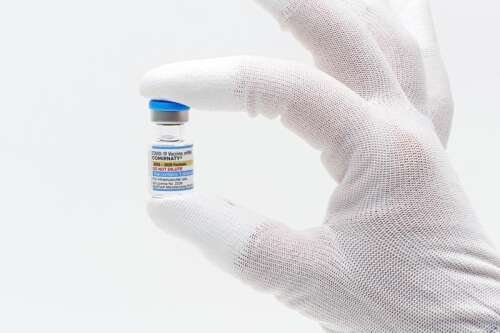 FDA approves updated COVID-19 shots but limits access for some kids and adults