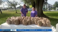 Two developmentally impaired adults start up a sack lunch program for those in need