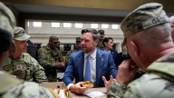 Top White House officials turn to public appearances with troops as a tense Washington watches
