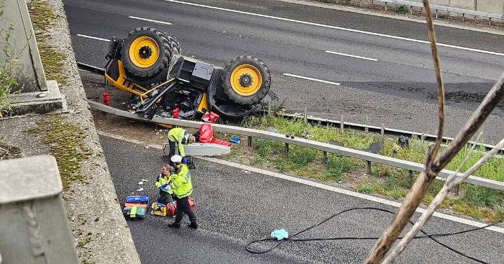 Kent Police gives update on driver after tractor falls off bridge on to M20