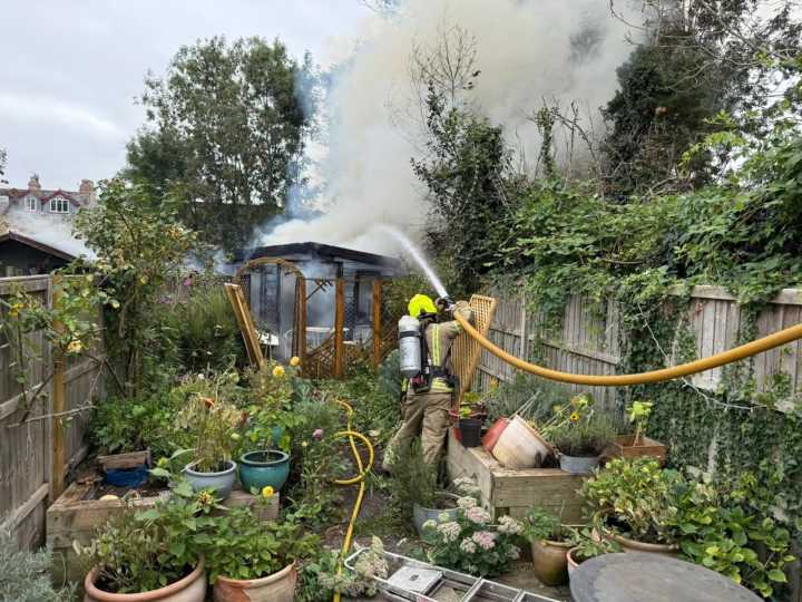 Woman injured after fire quickly spreads through gardens
