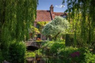 This blissful converted mill has sweeping views, a breathtaking library and gardens by a Chelsea gold medallist